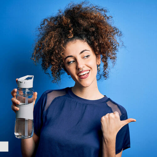 Blue Top Women Holding Bottle Image Before Photoshop Editing